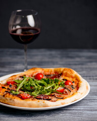 Christmas pizza on the wood board. Holiday celebration pizza. Copy space banner.