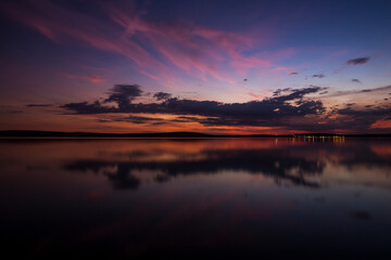 Pink Sky with Clouds at Dusk above the Sea