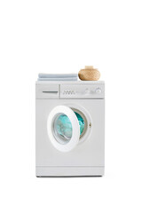Washing machine isolated white background with detergent and towel.