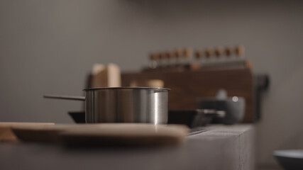 water boil on saucepan on kitchen stove with back light