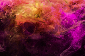 Paint in water. Colorful background. Abstract steam texture. Glowing vivid neon magenta pink purple orange mist mix spreading on dark.