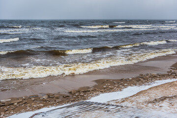 Footpath between winter Baltic Sea s dunes in Saulkrasti in Latvia