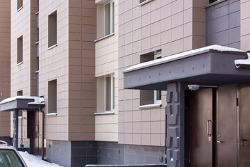 Fototapeta premium Fragment residential apartment with flat building exterior. Detail of New luxury house and home complex.