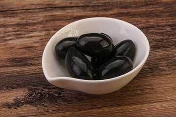 Pickled black olives in the bowl