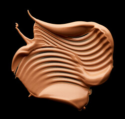 Makeup tone foundation smear isolated on black background