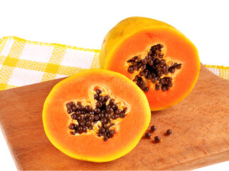 Half cut of ripe papaya with seeds isolated on white background.