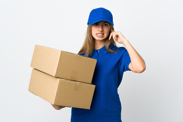 Young delivery woman over isolated white background frustrated and covering ears