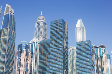 Fototapeta na wymiar Modern skyscrapers in the financial district of Dubai Marina. Dubai, United Arab Emirates.