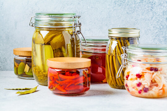 Homemade pickled and fermented vegetables in glass jars. Home preservation concept.