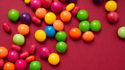 Fototapeta na wymiar colorful little candies on a colored background