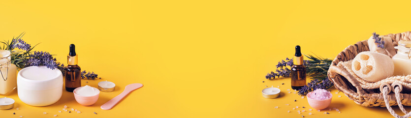 Yellow banner with lavender cosmetics products and place for text. Home body skin care, Spa setting