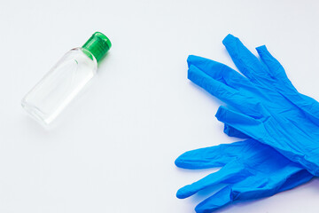 
medical gloves and snatiseptic on white background