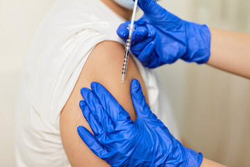 Close up of man vaccinated in a doctor's office