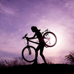 Fototapeta na wymiar Silhouette of bike woman 