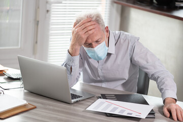Stressed businessman; concept of economic crisis due to the coronavirus outbreak