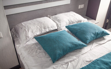 Comfortable pillows on the bed. Bed interior