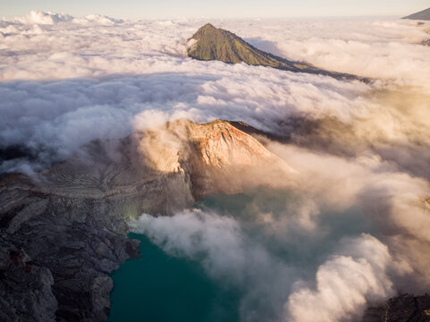 Aerial view of Ijen mountain range with its crater Kawah Ljen, known for its blue flames during a cloudy day, East Java, Indonesia.