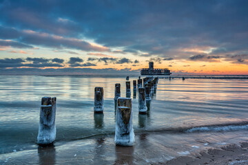 Amazing landscape of frozen beach of baltic Sea in Babie Doly at sunrise. Gdynia, Poland