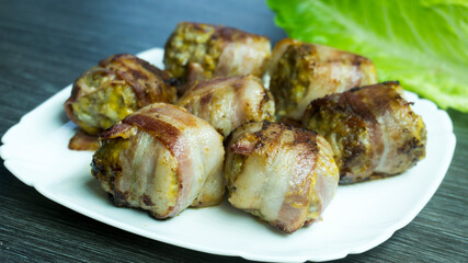 Bacon wrappped meatballs on white background