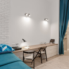 White bedroom with simple desk