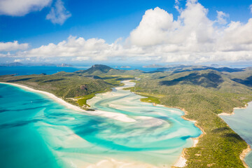 Aerial view of Whitsunday Island landscape with paradise beaches and crystal clear blue ocean water, Queensland, Australia.