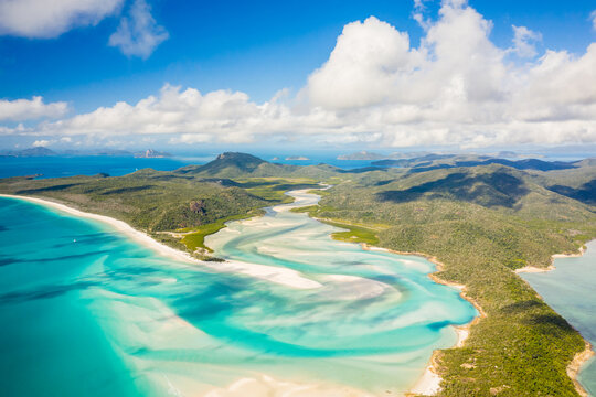 Aerial view of Whitsunday Island landscape with paradise beaches and crystal clear blue ocean water, Queensland, Australia.