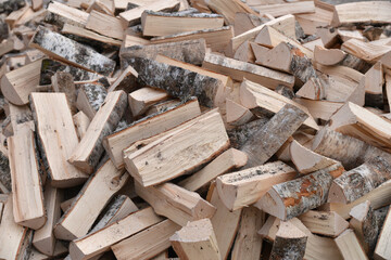A Stack of birch firewood close up. lot