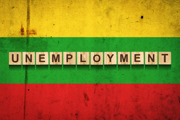 Obraz premium Unemployment. The inscription on wooden blocks on the background of the Lithuania flag. Unemployment growth. Business.