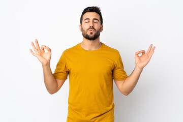 Fototapeta premium Young handsome man with beard isolated on white background in zen pose
