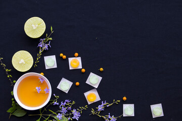 cough sore throat pastille pills from herbal honey and lemon with purple flowers arrangement flat...
