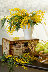 Bouquet of spring flowers in the interior. Mimosa. March 8