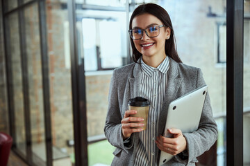 Amazing businesswoman enjoying her activity in office