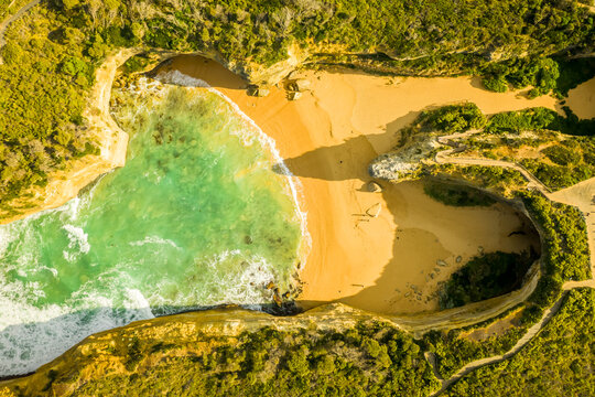 Aerial view of Loch Ard George, a natural sandy inlet with cliffs with a small paradise beach, Port Campbell, Victoria, Australia.