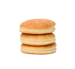 stack of baked round burger buns isolated on white background
