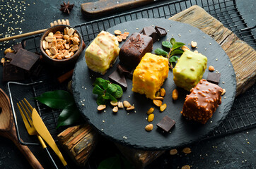 Set of colored cookies. Candy bar. Top view. Rustic style.