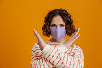 Portrait of young woman wearing medical protective mask