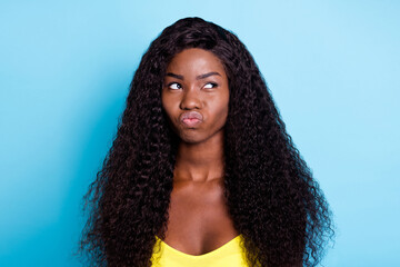 Portrait of attractive wavy-haired girl pouting lips overthinking isolated over bright blue color background