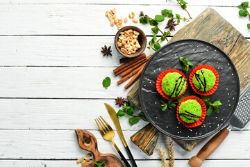 Dessert. Chocolate green cakes with coconut. Sweets. Top view. Rustic style.
