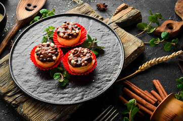 Dessert. Caramel cakes and chocolate pills. Sweets. Top view. Rustic style.