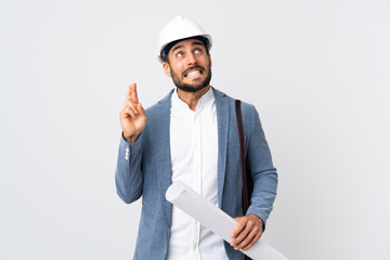 Young architect man with helmet and holding blueprints isolated on white background with fingers...