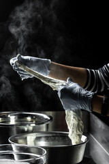 Cheesemaker showing the proceeding to make cheese from the bio milk. The homemade cheese maker produces caciocavallo. Pasta filata, Traditional Italian mozzarella