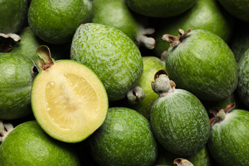 Fresh green feijoa fruits as background, closeup