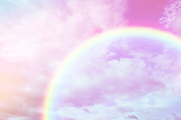 Amazing sky with rainbow and fluffy clouds, toned in unicorn colors
