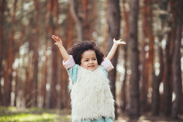 Cute excited little girl outdoors