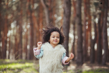 Cute excited little girl outdoors