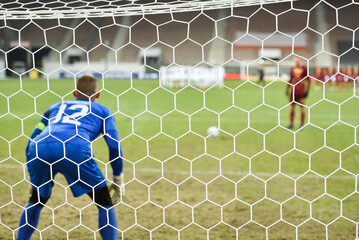 Net in the football goal penalty shootout in the background.