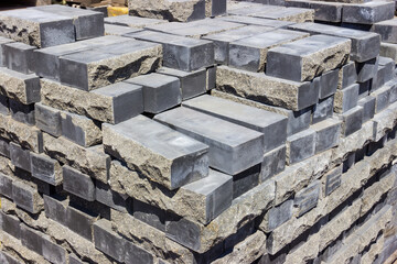 Gray decorative bricks with the natural stone imitation on warehouse