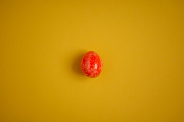 Red easter eggs on yellow background, place for text