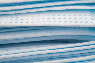 Textured surface of polyester fiber medical masks sideways closeup