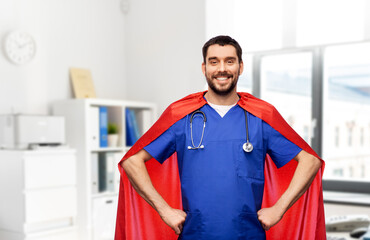 healthcare, profession and medicine concept - happy smiling doctor or male nurse in blue uniform...